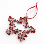 Decorazione stella perline rosse 10cm
